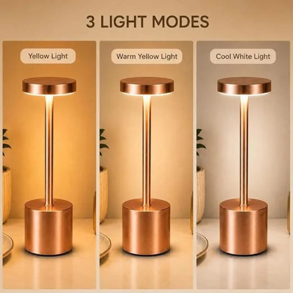 A three-panel comparison showing a slim cylindrical table lamp in three lighting modes: Yellow Light, Warm Yellow Light, and Cool White Light. The lamp has a metallic rose-gold/copper finish and is shown lit on a tabletop with a warm-toned background.