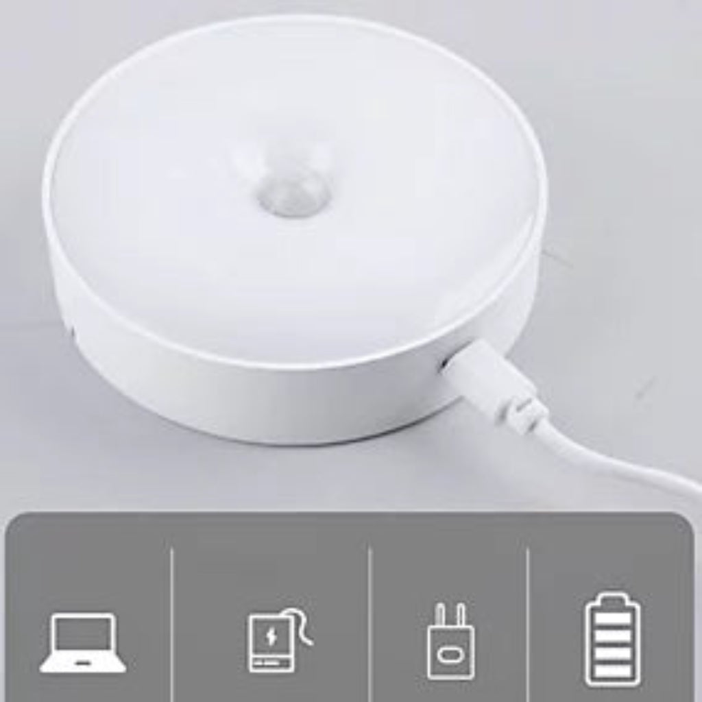 A white circular LED desk lamp with a USB charging port, shown on a light gray background with a gray feature icon strip at the bottom.