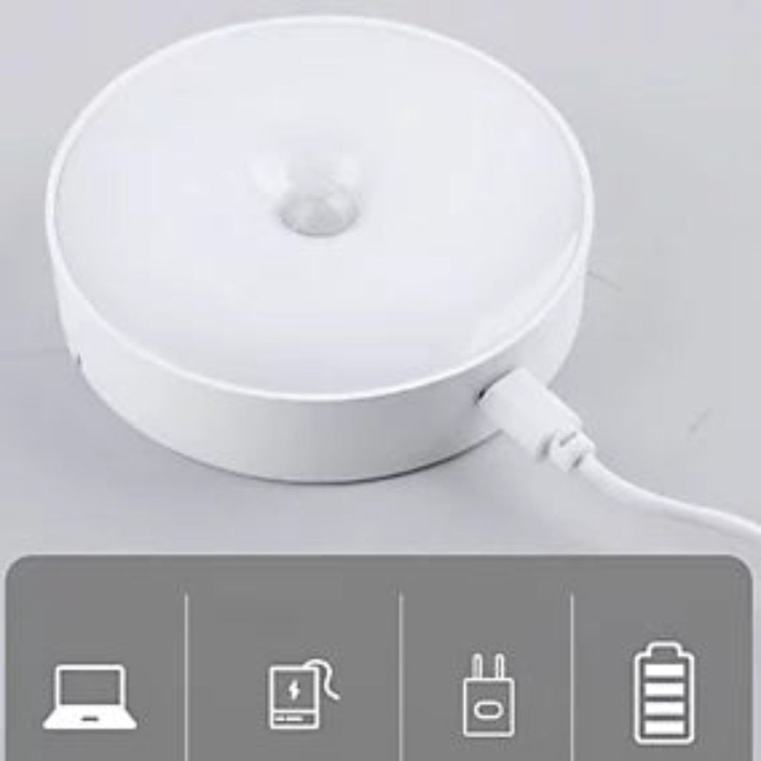 A white circular LED desk lamp with a USB charging port, shown on a light gray background with a gray feature icon strip at the bottom.