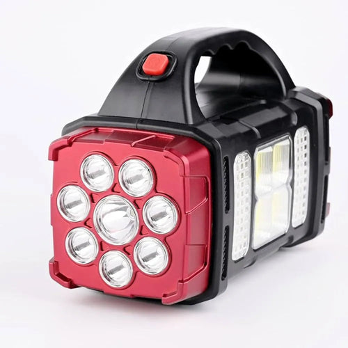 Red and black portable work light on a white background