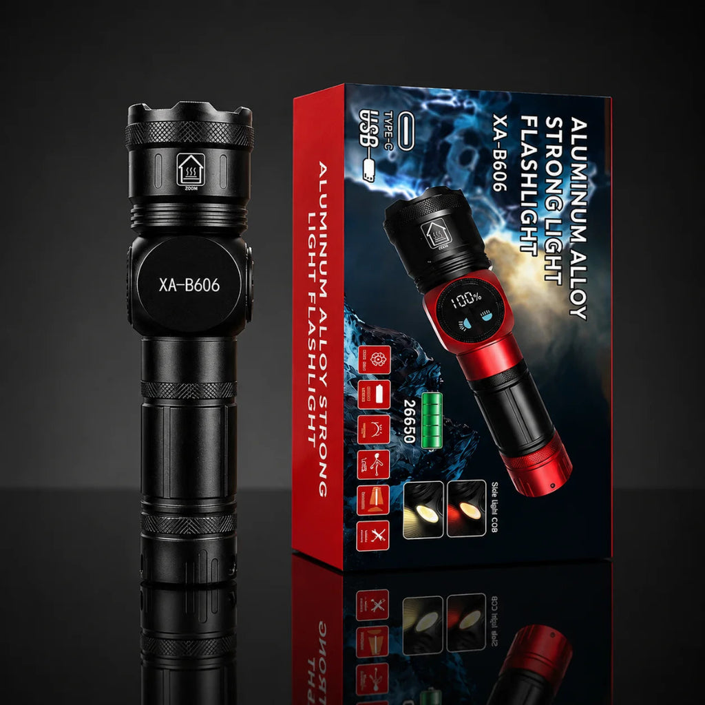 A black aluminum XA-B606 Rechargeable flashlight stands next to its retail box on a dark reflective studio background. The box is red and black with product text and an image of the flashlight.